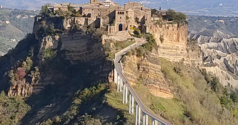 The footbridge rising to Civita di Bagnoregio on its eroded rock, with the gate at the top